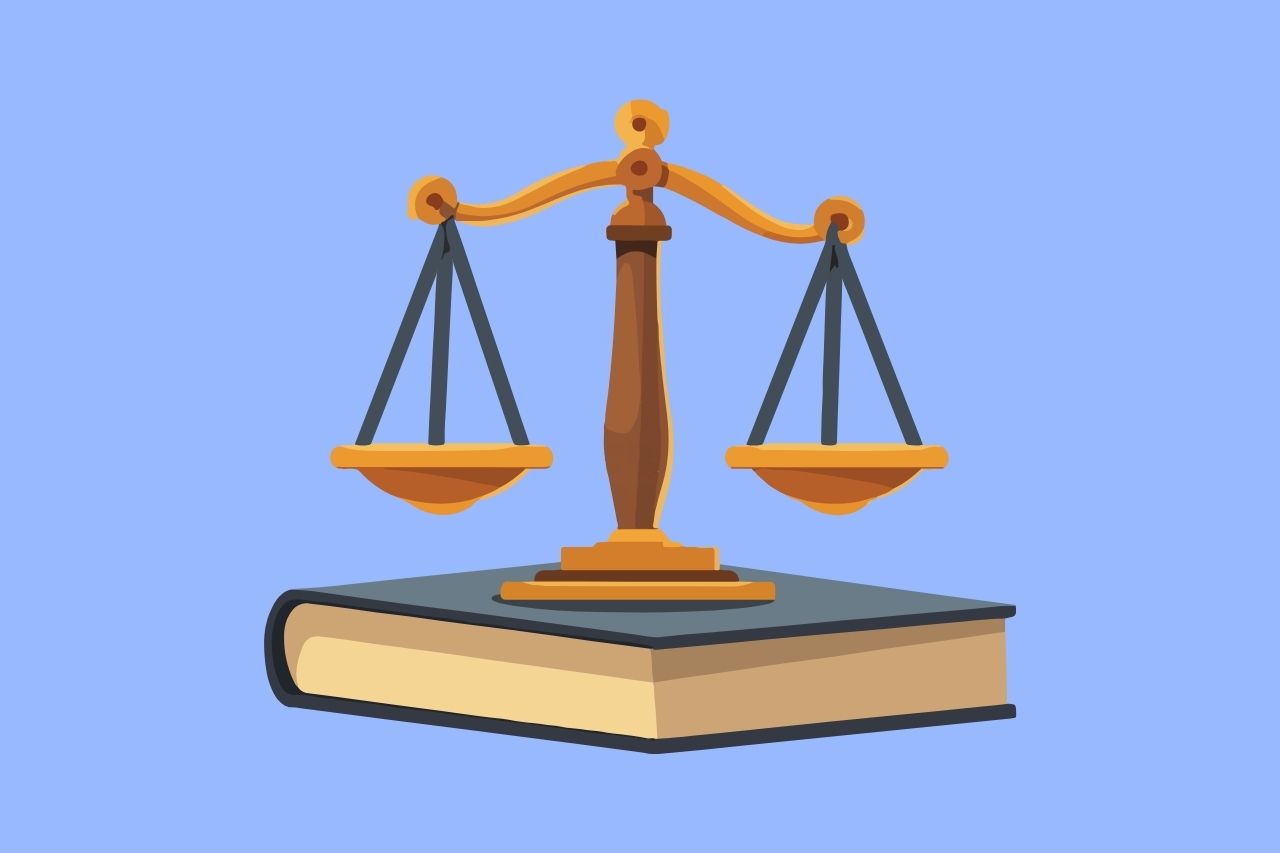 Illustration of balanced scales of justice resting on a closed law book, representing legal compliance.